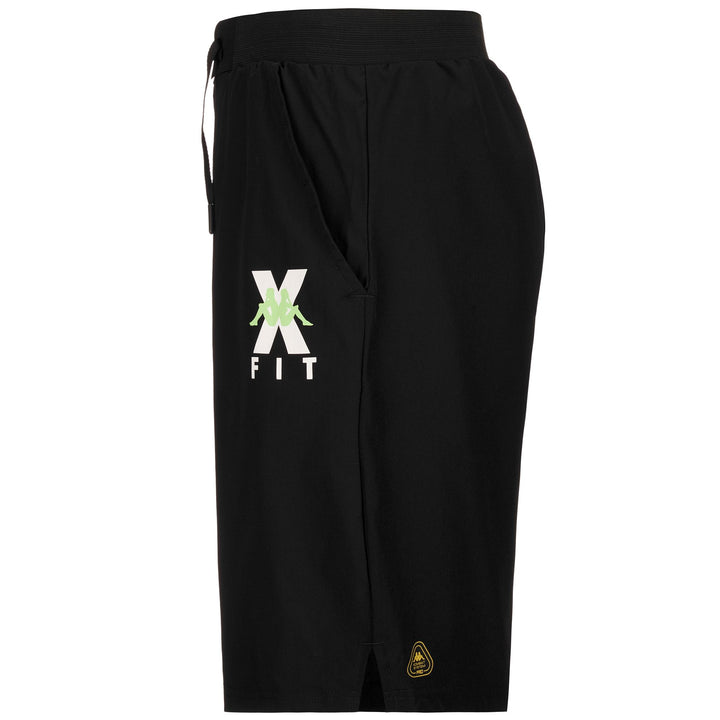 Shorts Man KOMBAT WKT EGAMENO Sport Shorts BLACK - GREEN PARADISE Dressed Front (jpg Rgb)	